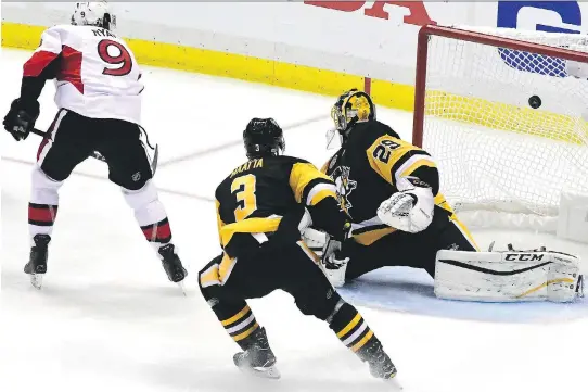 ?? MATT KINCAID/GETTY IMAGES ?? Bobby Ryan potted his second overtime winner of the post-season Saturday when he roofed a backhand over the Penguins’ Marc-Andre Fleury in Pittsburgh.