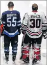  ?? CP PHOTO ?? Winnipeg Jets and the Chicago Blackhawks wore Broncos on the backs of their jerseys to honour the bus crash victims before their NHL game in Winnipeg on Saturday.