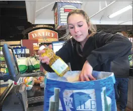  ??  ?? Falkowski, a nursing student at the University of Rhode Island, has worked at the Coventry Dave’s Marketplac­e since she was in high school.