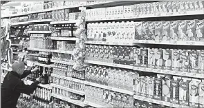  ?? (Courtesy pic) ?? An employee restocks shelves with food products inside a Shoprite Holdings store in Cape Town in this file photo. A VAT hike would make it harder for cash-strapped consumers to buy goods.