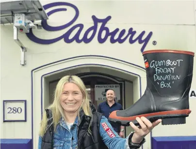  ?? PHOTO: PETER MCINTOSH ?? Roll up, roll up . . . Former Cadbury employees Megan Fairley and David Bettis are looking forward to hosting one last weekend of tours through the factory.