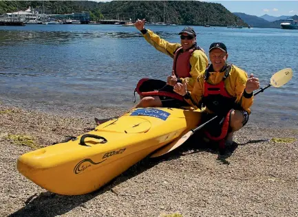  ?? PHOTO: JEFFREY KITT/FAIRFAX NZ ?? Zane Charman, left, and Grant Boyd celebrate reaching Picton after successful­ly kayaking Cook Strait for charity.