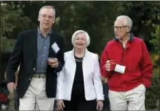  ?? BRENNAN LINSLEY — THE ASSOCIATED PRESS ?? Federal Reserve Chair Janet Yellen, center, strolls with Stanley Fischer, right, vice chairman of the Board of Governors of the Federal Reserve System, and Bill Dudley, the president of the Federal Reserve Bank of New York, before her speech to the...