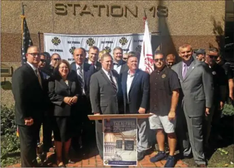  ?? SULAIMAN ABDUR-RAHMAN — THE TRENTONIAN ?? Hamilton Township career firefighte­r unions rally at the Rusling Hose Fire Co. to endorse 2017 Democratic Hamilton Council candidates Anthony Carabelli Jr., Jeff Martin and Rick Tighe on Thursday, Sept. 28, 2017.