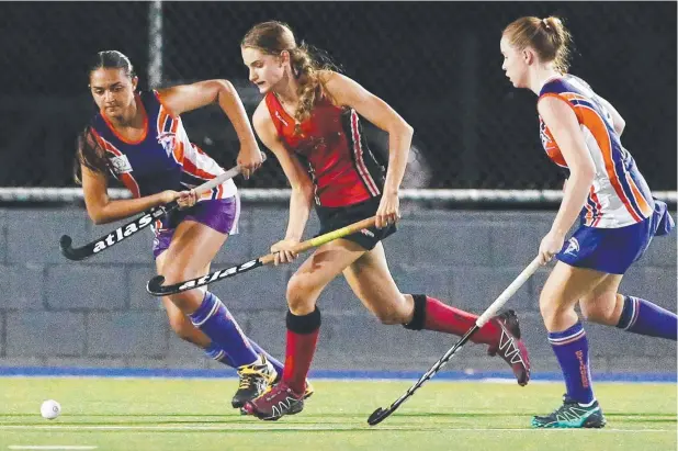  ?? Picture: BRENDAN RADKE ?? RUN UP: Stingers' Billee Mahendrara­jah and Souths' Georgia Trompf contest the ball in their weekend game, which Souths won 3-0.