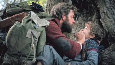  ?? JONNY COURNOYER/PARAMOUNT ?? A dad and his son (John Krasinski, Noah Jupe) must be silent to be safe in "A Quiet Place."