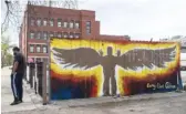  ?? PAT NABONG/SUN-TIMES FILE ?? A memorial for 13-year-old Adam Toledo is painted on a fence near Farragut Career Academy. Adam was shot and killed at that spot by a Chicago police officer on March 29, 2021.