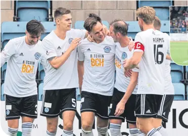  ??  ?? Dundee transfer target Lawrence Shankland celebrates his opener with Ayr team-mates