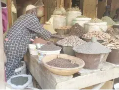  ?? ?? A trader selling spices at one of the local markets in Kano