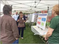  ?? EVAN BRANDT — MEDIANEWS GROUP ?? Montgomery County transporta­tion planner Crystal Gilchrist explains the goals of the open house and the plan to a visitor Tuesday evening.