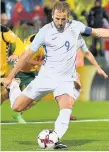  ??  ?? Harry Kane slots home England’s penalty