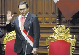  ?? Martin Mejia ?? The Associated Press President Martin Vizcarra waves after he was sworn in to office Friday in Lima, Peru.