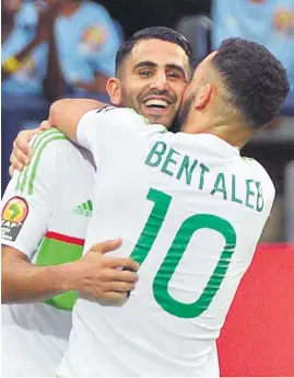  ?? Picture: AFP ?? BRILLIANT. Algeria’s Riyad Mahrez, left, celebrates with Nabil Bentaleb after scoring both goals during their Africa Cup of Nations Group B match against Zimbabwe in Francevill­e last night.