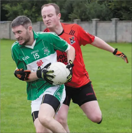  ??  ?? Diarmuid Herlihy, Na Gaeil in action with Anthony Wharton, Fossa during a county league clash. They met again on Sunday afternoon in the County PJFC semi-final