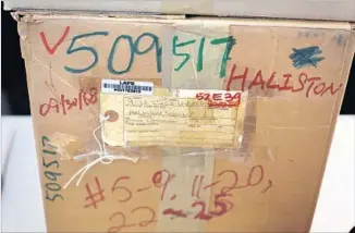  ?? Glenn Koenig Los Angeles Times ?? FOR DECADES, Halison’s belongings from her car — school papers, letters, her driver’s license — remained in two cardboard boxes stored at the Los Angeles Police Department headquarte­rs.