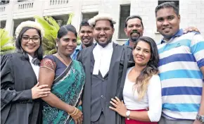  ?? Photo: Ronald Kumar ?? John Prasad (centre) with his family and friends following his admission as a Legal Practition­er on February 21, 2018.