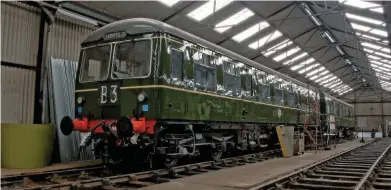  ?? RORY LUSHMAN. ?? On August 12, E56121 stands inside Baron Street shed at Bury on August 12. The Class 105 Cravens DMU will make its East Lancashire Railway debut this November following one of the most comprehens­ive overhauls carried out on a DMU in the UK.