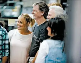 ?? DAVID ZALUBOWSKI/AP ?? Baker Jack Phillips, center, owner of Masterpiec­e Cakeshop, in Lakewood, Colo., is surrounded by supporters inside his shop after the U.S. Supreme Court ruling Monday.