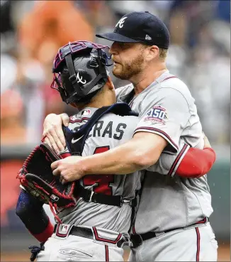  ?? NICK WASS/ASSOCIATED PRESS ?? Relief pitcher Will Smith and catcher William Contreras celebrate the Braves’ 3-1 win Sunday over the Orioles, the Atlanta team’s ninth consecutiv­e victory, all on the road.