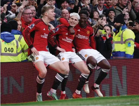  ?? EPA ?? Alejandro Garnacho, centre, celebrates after scoring Manchester United’s second goal with Rasmus Hojlund and Kobbie Mainoo