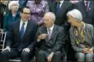  ?? JOSE LUIS MAGANA — THE ASSOCIATED PRESS ?? From left, U.S. Treasury Secretary Steven Mnuchin, Germany Finance Minister Wolfgang Schäuble, and Internatio­nal Monetary Fund (IMF) Managing Director Christine Lagarde speak during the Monetary Fund (IMF) Governors group photo during World Bank/IMF...