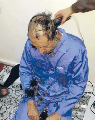  ?? Photos: REUTERS ?? Niger stay cut short: Saadi Gaddafi’s long hair and beard are shaved after his arrival in prison in Tripoli.