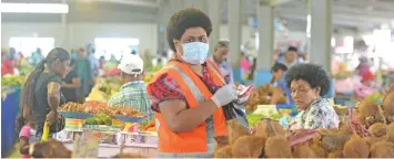  ?? Photo: Ronald Kumar ?? Nausori Market attendant, Kinisiana Livia stays safe by using a face mask.