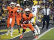  ?? MATTHEW HINTON — THE ASSOCIATED PRESS FILE ?? In this Sept. 23 photo, Syracuse wide receiver Ervin Philips (3) scores a touchdown against LSU during the second half as quarterbac­k Eric Dungey (2) celebrates in the end zone during an NCAA college football game in Baton Rouge, La.