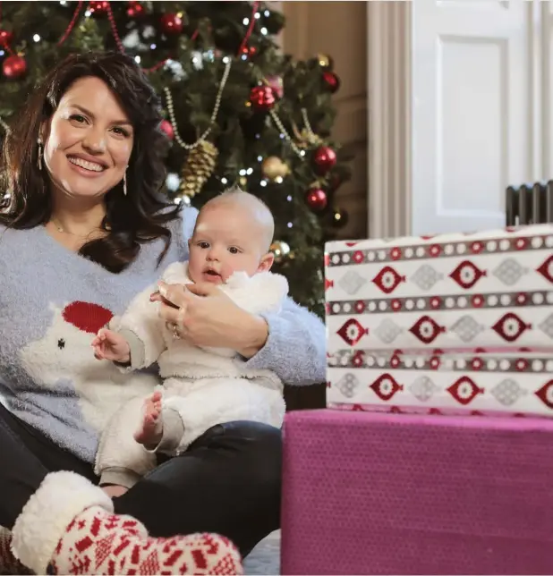  ??  ?? Caroline Morahan with her baby boy Rowan sit down to celebrate baby’s first Christmas. Photo: David Conachy