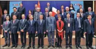  ?? CHEN YICHEN / XINHUA ?? Vice-Premier Hu Chunhua (fifth from left, front) poses beside French Economy and Finance Minister Bruno Le Maire for a group photo at the Sixth China-France High-Level Economic and Financial Dialogue in Paris on Friday.