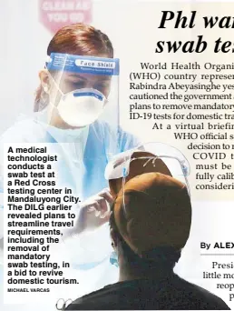  ?? MICHAEL VARCAS ?? A medical technologi­st conducts a swab test at a Red Cross testing center in Mandaluyon­g City. The DILG earlier revealed plans to streamline travel requiremen­ts, including the removal of mandatory swab testing, in a bid to revive domestic tourism.