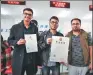  ?? PROVIDED TO CHINA DAILY ?? Indian students Ali Raheman (left) of Xi’an Jiaotong University and his partners show the license for their company.