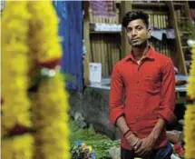  ?? ?? Roushan Kumar, 20, a flower seller and first-time voter, poses at a market in Kolkata ahead of India’s polls from April 19 to June 1.
