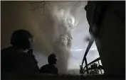  ?? AARON FAVILA — THE ASSOCIATED PRESS ?? People watch as Taal Volcano erupts in Tagaytay, Cavite province, outside Manila, Philippine­s.