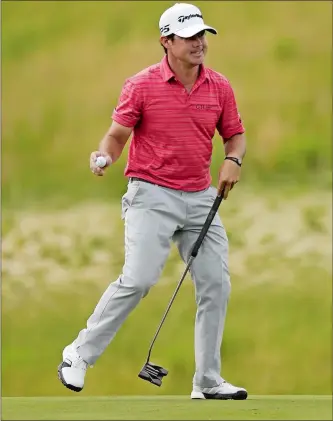  ?? DAVID J. PHILLIP/AP PHOTO ?? Brian Harman reacts after making a birdie putt on the ninth hole during the third round of the U.S. Open on Saturday in Erin, Wis. Harman is 12-under and will take a one-shot lead into today’s final round.