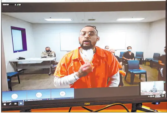  ?? K.M. Cannon Las Vegas Review-journal @Kmcannonph­oto ?? James Hull appears in court via video for sentencing Wednesday on a weapons charge at the Regional Justice Center.