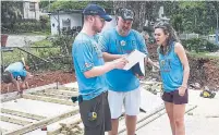  ??  ?? Matthew Lynch, left, of Centric Engineerin­g, Doug Tarry and Rebecca Graham look over notes on work to be done.