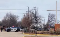  ?? JESSIKA HARKAY/STAR-TELEGRAM ?? Colleyvill­e police secure the area around Congregati­on Beth Israel synagogue on Saturday in Colleyvill­e, Texas. Authoritie­s say a man had apparently taken hostages at the synagogue.