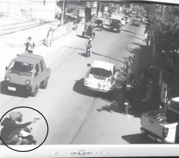  ??  ?? A screen grab of the CCTV footage shows a motorcycle rider shooting at the vehicle driven by businessma­n Junide Daligdig who was ambushed by six unidentifi­ed gunmen Monday afternoon in Lapu-Lapu City.