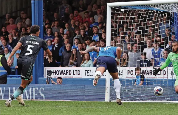  ?? ?? Ellery Balcombe makes a save from Peterborou­gh’s former Bristol Rovers striker Jonson Clarke-Harris