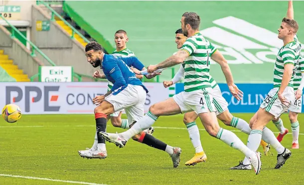  ??  ?? HEAD MAN: Connor Goldson gets in front of the Celtic defence to score the first of his double in the victory over the Hoops at Celtic Park.