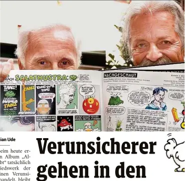  ??  ?? Eberhartin­ger und Spitzer mit der BuchEditio­n von „Alles ist erlaubt“: Sie bietet Comics und Karikature­n sowie eine zusätzlich­e CD mit DemoVersio­nen