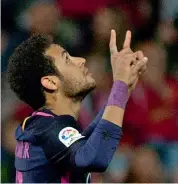  ?? — AFP ?? Barcelona’s Neymar celebrates after scoring in their La Liga match against Granada FC at the Nuevo Los Carmenes Stadium in Granada on Sunday,