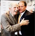  ??  ?? In this 2017 file photo, former team owner Robert Yates, left, is congratula­ted by Winston Kelley, right, executive director of the NASCAR Hall of Fame, after being named as a member of the class of 2018 during an announceme­nt at the NASCAR Hall of...