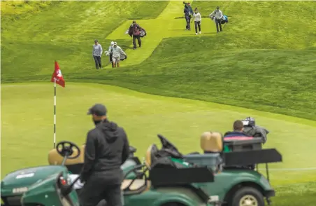  ?? Santiago Mejia / The Chronicle ?? One caddie said, “This course ... makes you really strategize on your approach shots, because there’s a lot going on around the greens.”