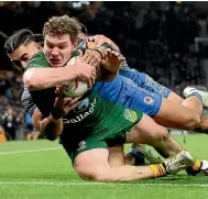  ?? ?? Liam Martin scores one of Australia’s six tries in the 30-10 World Cup final victory over Samoa yesterday.