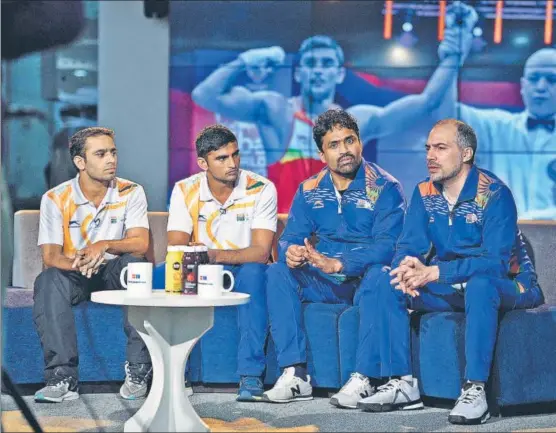  ?? RAJ K RAJ/HT PHOTO ?? Boxers Amit Panghal (from left), Manish Kaushik with coaches CS Kutappa and Santiago Nieva during an interview with Hindustan Times, at the HT House in New Delhi on Monday.