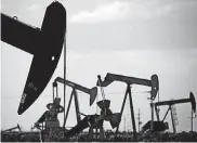  ?? [AP FILE PHOTO] ?? In this 2015 file photo, pumpjacks work in a field near Lovington, N.M. Thanks to more barrels of oil being pumped monthly from the Permian Basin, New Mexico is among the nation’s top producing states.