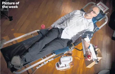  ?? Picture / Jason Oxenham ?? NZME regional news editor Edward Rooney gives blood at the New Zealand Trade Centre on Albert St, Auckland. He is one of a tiny percentage of paediatric donors whose blood can be given to newborn babies.