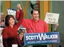  ?? MICHAEL SEARS / MILWAUKEE JOURNAL SENTINEL ?? Gov. Scott Walker and Lt. Gov. Rebecca Kleefisch raise arms at a campaign rally Sunday. To view a video and photo gallery, go to jsonline.com/news.